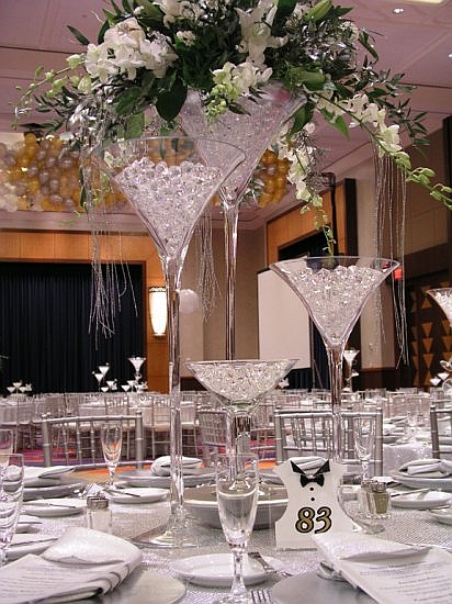 Tie a silver or gold ribbon to the mouth of the vase to add some pizzazz
